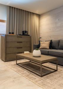 a living room with a couch and a coffee table at Nassau Suite South Beach, an All Suite Hotel in Miami Beach