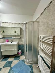 a bathroom with a shower and a sink at CASAVACANZETOFFEE in Bologna