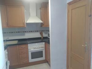 Kuchyň nebo kuchyňský kout v ubytování Atico Duplex 1ª