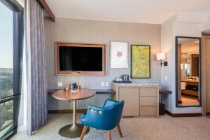 TV a/nebo společenská místnost v ubytování Drey Hotel