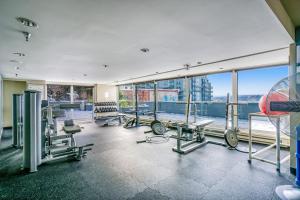 a gym with cardio equipment in a building at Golden Eye Seattle in Seattle