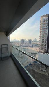 a view of a city from a building balcony at studio apartment 60 sqm skyline veiw in Dubai
