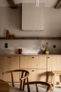 Kuchyňa alebo kuchynka v ubytovaní Chalet V11 by Villa 11 Folk & Design