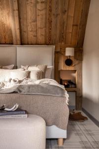 Posteľ alebo postele v izbe v ubytovaní Chalet V11 by Villa 11 Folk & Design