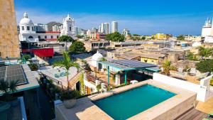 an aerial view of a city with a swimming pool at Masaya Santa Marta in Santa Marta