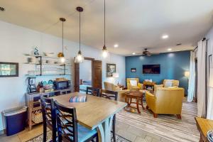 a dining room and living room with a table and chairs at Abruzzi - Villas C & D in Eatonton 