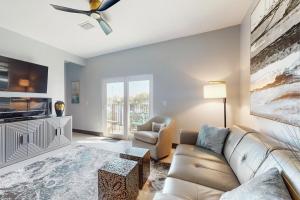 a living room with a couch and a tv at Riverfront Paradise in Melbourne