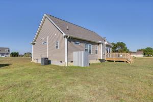 a large house with a large yard with a deck at Cape Charles Home 4 Mi to Kiptopeke State Park! in Cape Charles