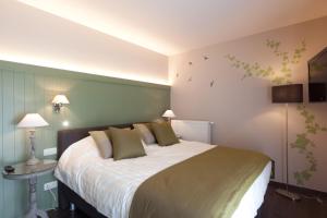 Postel nebo postele na pokoji v ubytování B&B Riche Terre