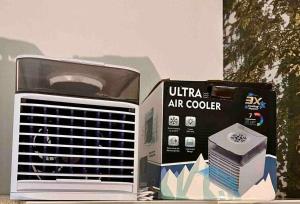 an air cooler and a box on a table at Stylish Rooms- habitaciones ELCHE CENTRO- in Elche