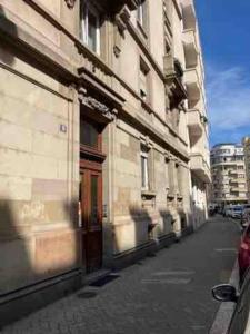 a building on the side of a street at Joli 2 pièces - Krutenau Austerlitz in Strasbourg