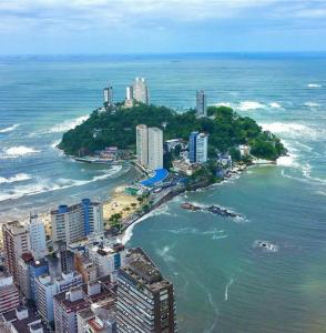 an aerial view of a city and the ocean at Família Pereira in São Vicente