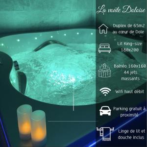 多勒La voute Doloise - Love room & spa的喷泉浴缸标志