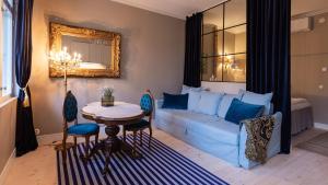 a living room with a couch and a table at Villa Maija 2 Southside in Hanko