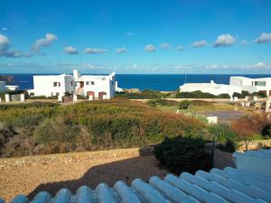 a view of the ocean from the roof of a house at Villa Amor in Cala Morell