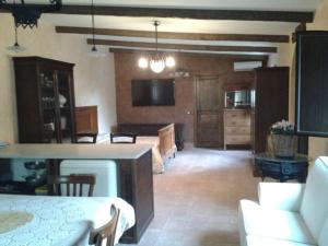 a living room with a kitchen and a dining room at A Casa di Ludo - Apartments & Short Lets in Catania