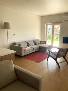 a living room with a couch and a table at Ar da Beira - Serra da Estrela in Belmonte