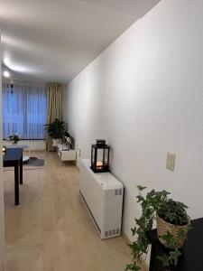 a living room with a heater and a table at 5ensational appartement - Centre in Brussels