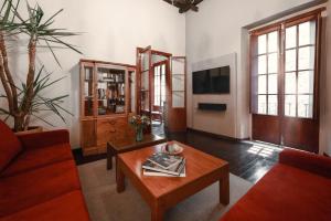 a living room with a couch and a coffee table at Antiguo Molino de San Jerónimo in Mexico City