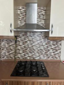 a kitchen with a stove top in a kitchen at Overland Residence in Istanbul