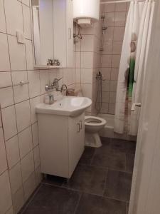 a white bathroom with a sink and a toilet at Apartment in Trpanj with terrace, air conditioning, WiFi, washing machine 4199-3 in Trpanj