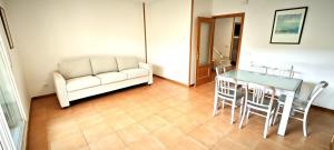 a living room with a table and a couch at Vistas Río Tormes Huerta Otea in Salamanca