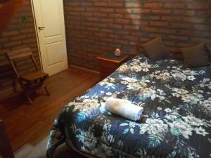 A bed or beds in a room at La palmera