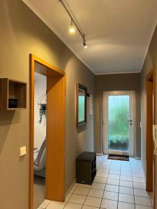 a room with a hallway with a door and a room with a door at Sunset Apartment mit Rheinblick in Urbar in Urbar
