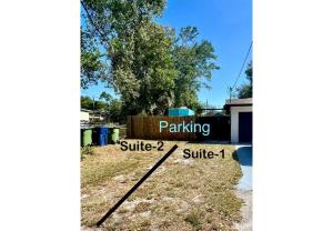 a sign for parking at a parking lot at Busch Gardens Bliss Suite-2 in Tampa