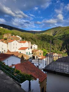 a view of a town with houses and hills at Free Spirit in Vale do Torno