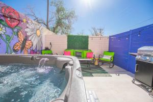 a swimming pool in a backyard with a mural at Bohemian Chic an Eclectic Escape-Hot Tub-Pet Friendly-No Pet Fees! in Albuquerque
