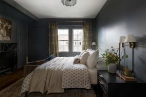 a bedroom with a bed and a window at The Craft House Inn in Santa Barbara