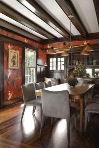 a dining room with a table and chairs at The Craft House Inn in Santa Barbara