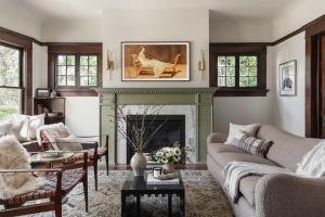 a living room with a couch and a fireplace at The Craft House Inn in Santa Barbara