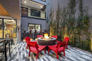 a patio with a table and chairs and a fire pit at Infinity Hotel San Francisco, Tapestry Collection by Hilton in San Francisco
