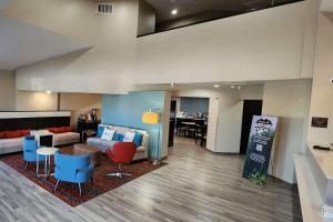 a lobby with a living room and a dining room at Sleep Inn Olathe - Kansas City in Olathe