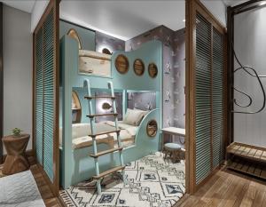 a childs room with a bed in the corner of a room at Holiday Inn Resort Bali Canggu by IHG in Canggu