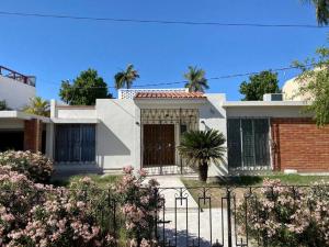 a house with a gate in front of it at Casa Tehuantepec, 5hab 4.5baños in Hermosillo