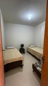 Een bed of bedden in een kamer bij Casa Unamar