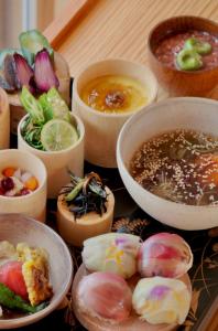 a table topped with bowls of different types of food at 禅坊 靖寧 Zenbo Seinei in Awaji