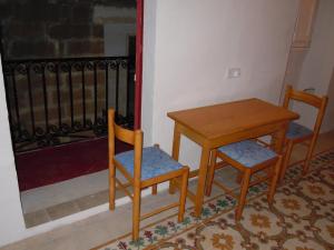 a table and two chairs and a table and a table at Number 20 in Birgu