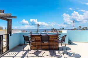 a bar on a balcony with a view of the beach at Cielomar in Tijuana