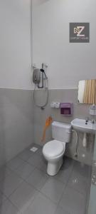 a bathroom with a toilet and a sink at Nz comfort house pandan kuantan in Kuantan