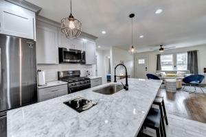 a kitchen with a sink and a counter top at New Home in MidTown- Sleeps 11 For Rent in Atlanta in Atlanta