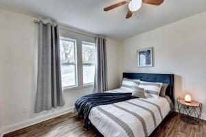 a bedroom with a bed and a ceiling fan at New Home in MidTown- Sleeps 11 For Rent in Atlanta in Atlanta