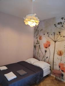 Ein Bett oder Betten in einem Zimmer der Unterkunft Logement de Ville 4 chambres proche de Lille
