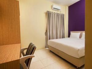 Postel nebo postele na pokoji v ubytování RAP Hotel Balige