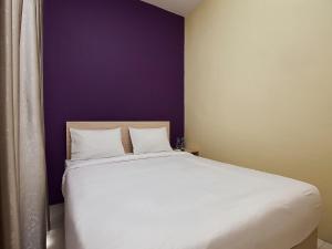 Postel nebo postele na pokoji v ubytování RAP Hotel Balige