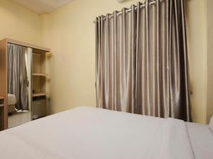 Postel nebo postele na pokoji v ubytování RAP Hotel Balige