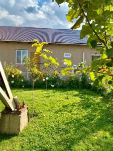 a garden with trees in the yard of a house at GreenHouse in Naryn